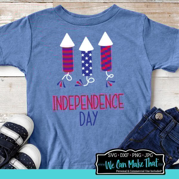 SVG Fireworks design in red white and blue mockup on a kids blue shirt.
