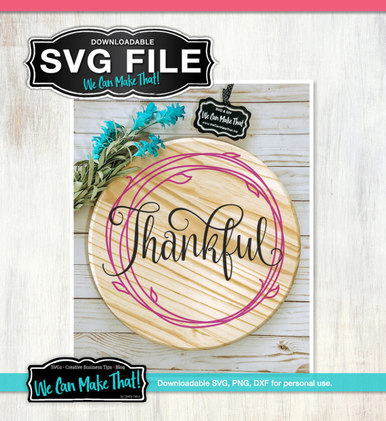 "Thankful" written in a script font within a circular pink floral wreath design printed on a circular wood tray.