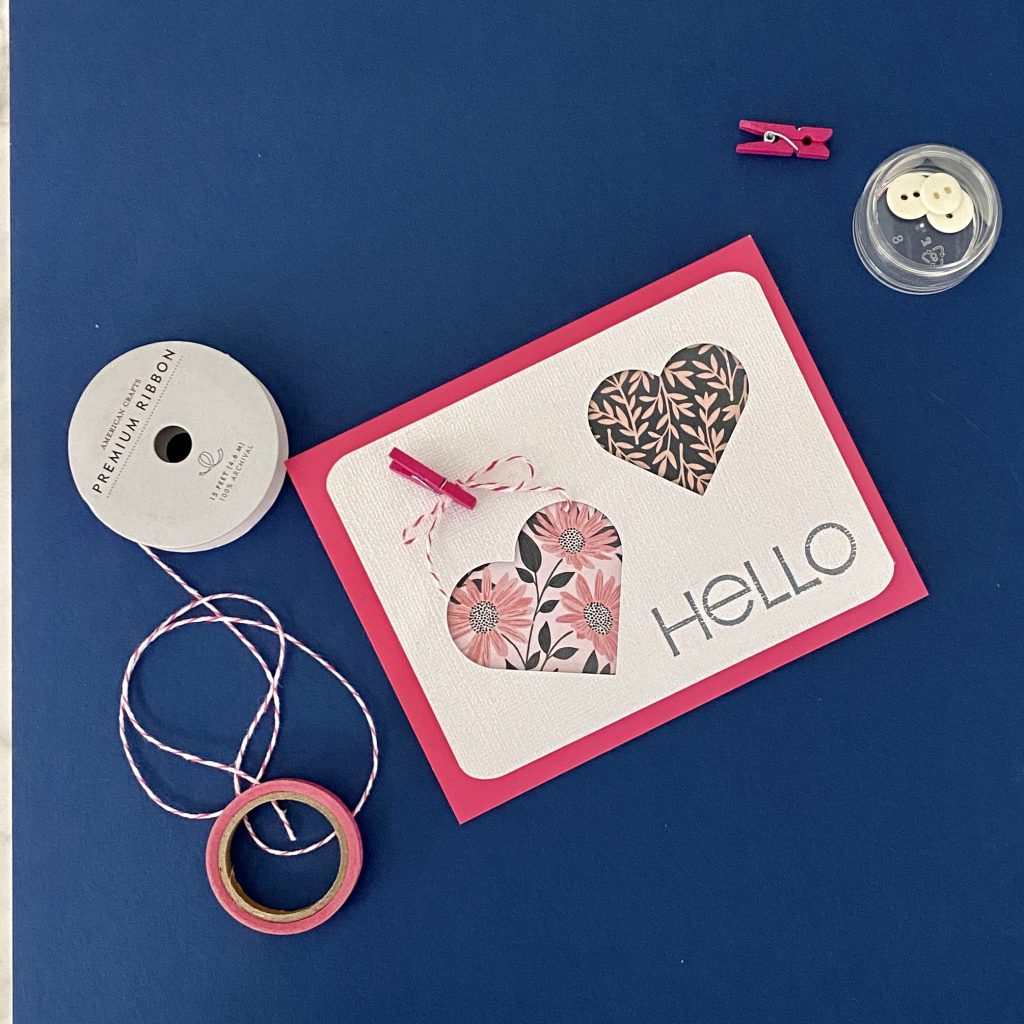heart card with supplies on navy background
