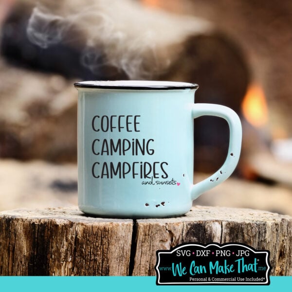 Light blue enamel mug sitting on a wood stump with steam rising and a campfire in the background. The mug features the phrase “Coffee, Camping, Campfires, and Sunsets” in black text with a pink heart.