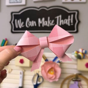 Pink bow made from paper and cut on a Cricut.