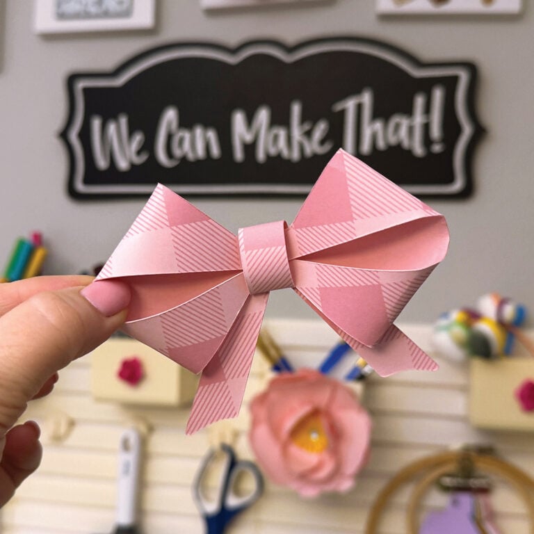 Pink bow made from paper and cut on a Cricut.