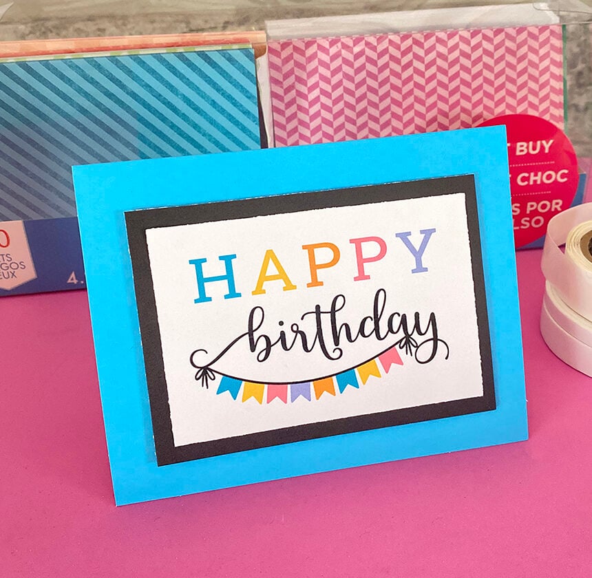 Festive Happy birthday card placed upright on a countertop.