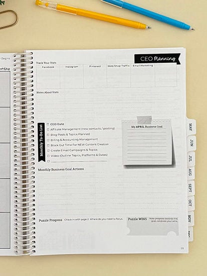 Small Business planner open on yellow backgroup.