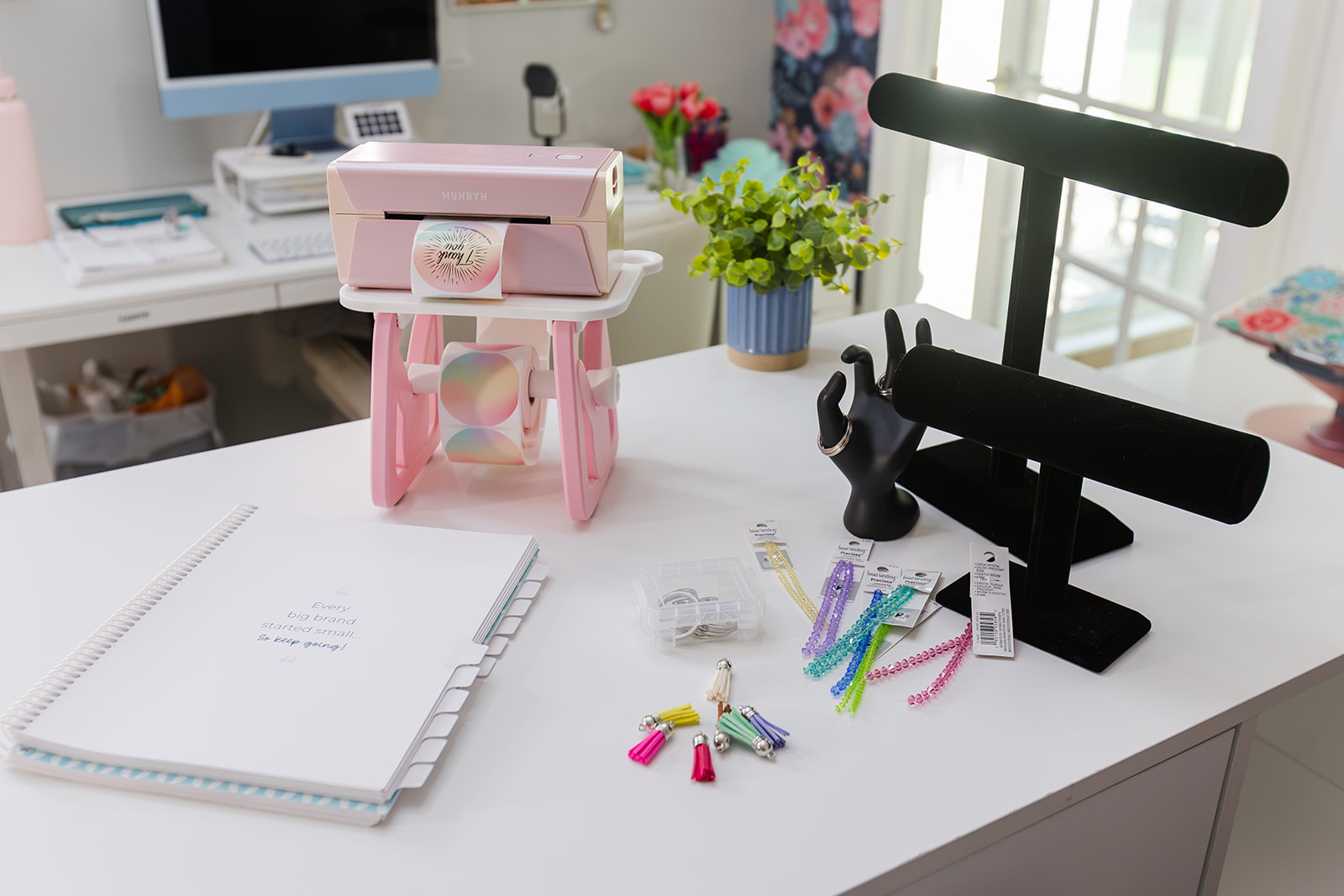Shipping printer with small business planner on desk.